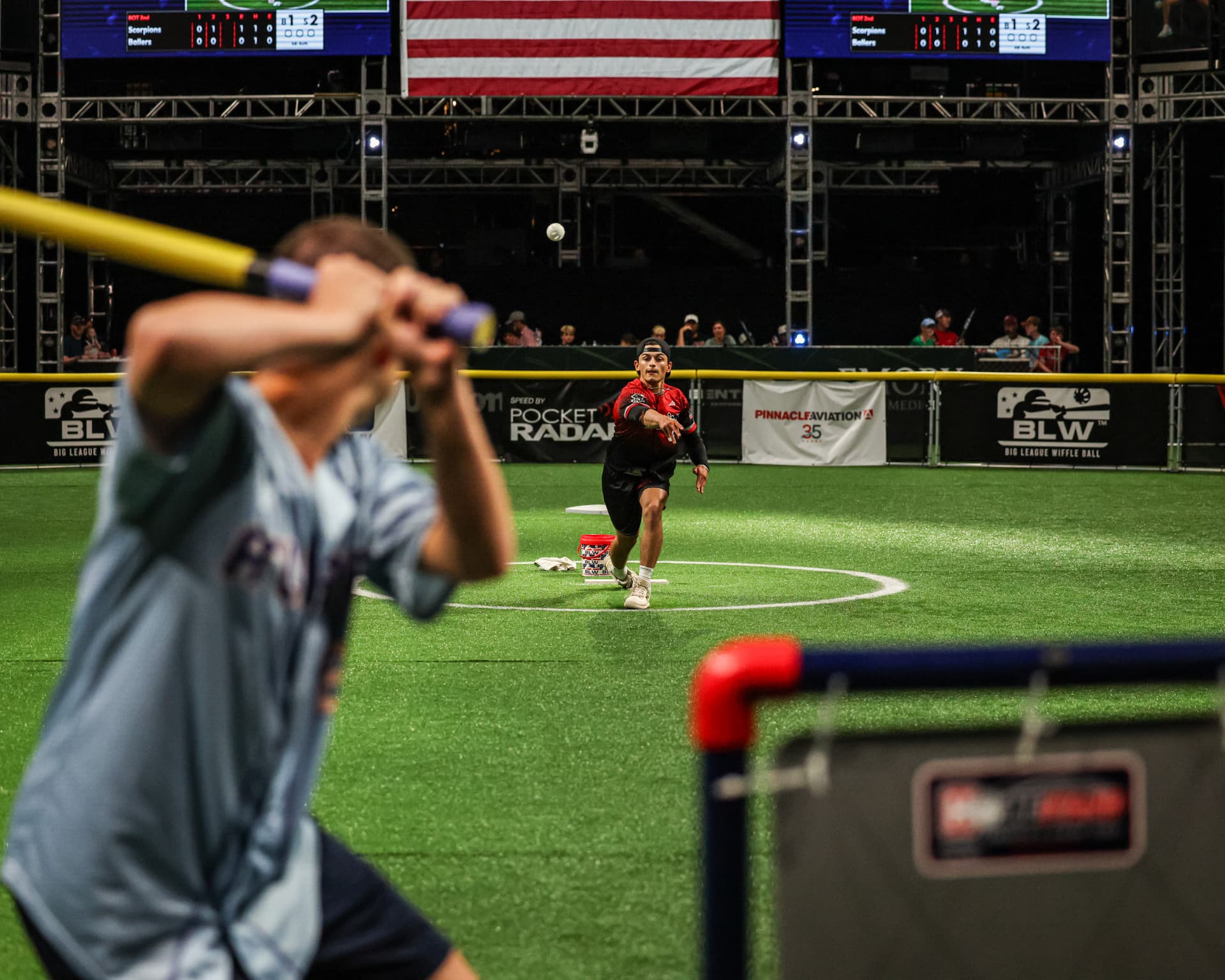 Philadelphia Wiffle Club players celebrating in front of a packed crowd